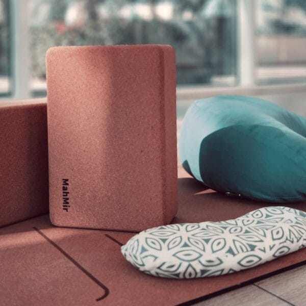 Yoga props setup – featuring yoga mats, blocks, straps, and bolsters neatly arranged in a yoga studio, ready for practice